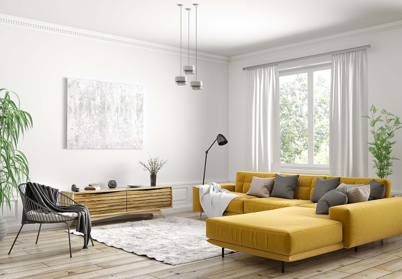 Living room with yellow sofa and semi-sheer rod pocket panels
